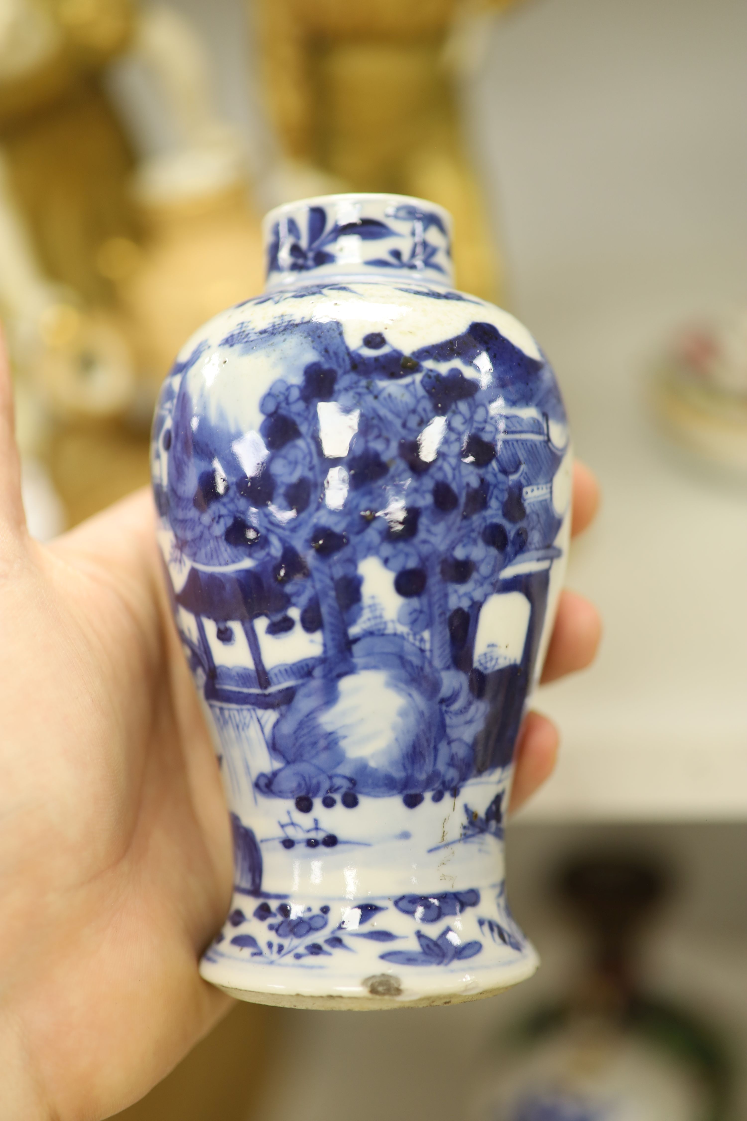 Three Chinese blue and white vases, a cloisonne enamel vase, another vase and a soapstone figure